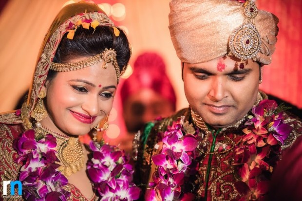 beautiful red and gold themed real wedding in Varanasi