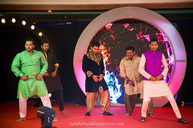 Indian baraatis dancing at Bollywood themed destination Goa wedding