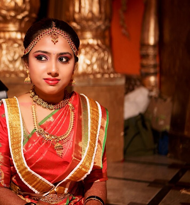 traditional South Indian bridal makeup orange and gold wedding theme