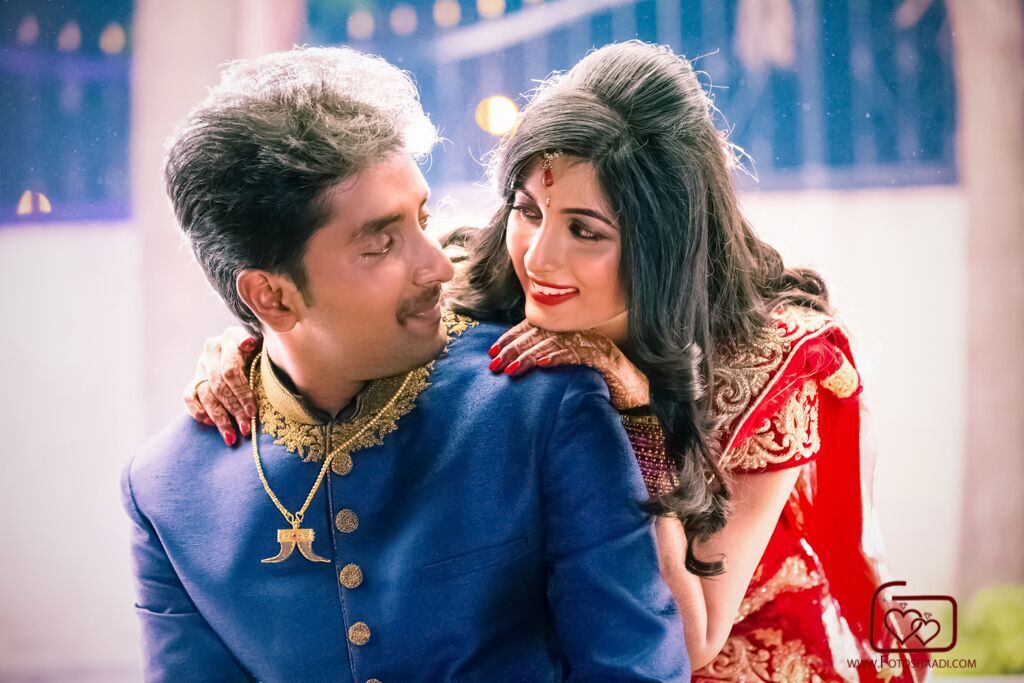bride red sari and groom blue sherwani real wedding in India