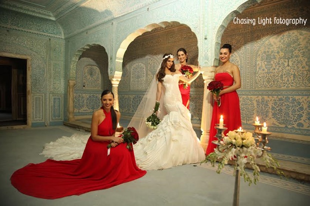 red bridesmaid dresses-real Indian wedding-Samode palace wedding Jaipur