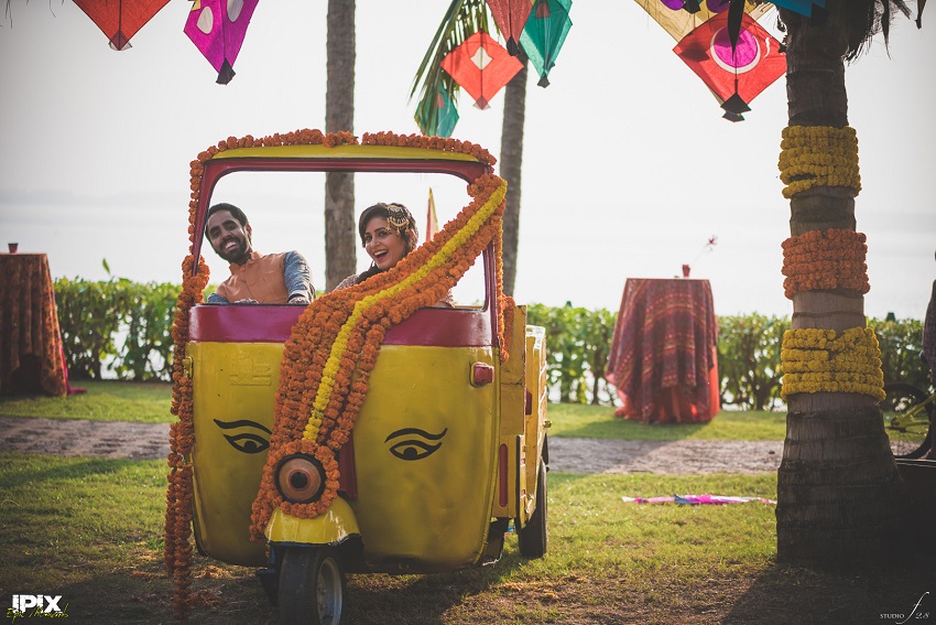 bride and groom in a decorated rickshaw Cineyug Celebrations wedding planners