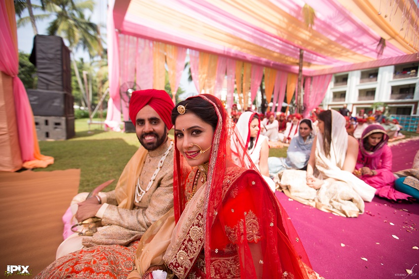 bride and groom red lehenga beautiful Sikh wedding in Grand Hyatt Goa
