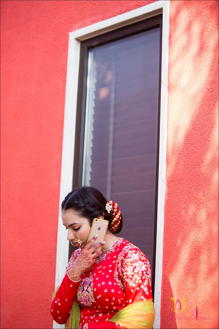 bride talking on phone-fusion Marwari Tamil destination wedding in Goa