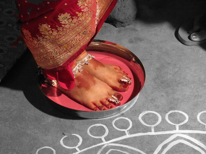 Feet in alta Indian wedding ritual
