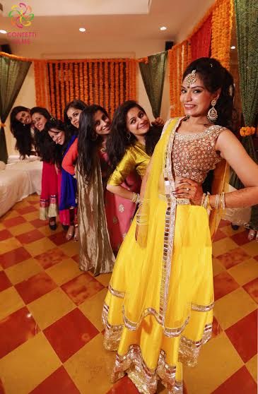 Indian bride with her bridesmaids-Yellow lehenga and colourful bridesmaid dresses
