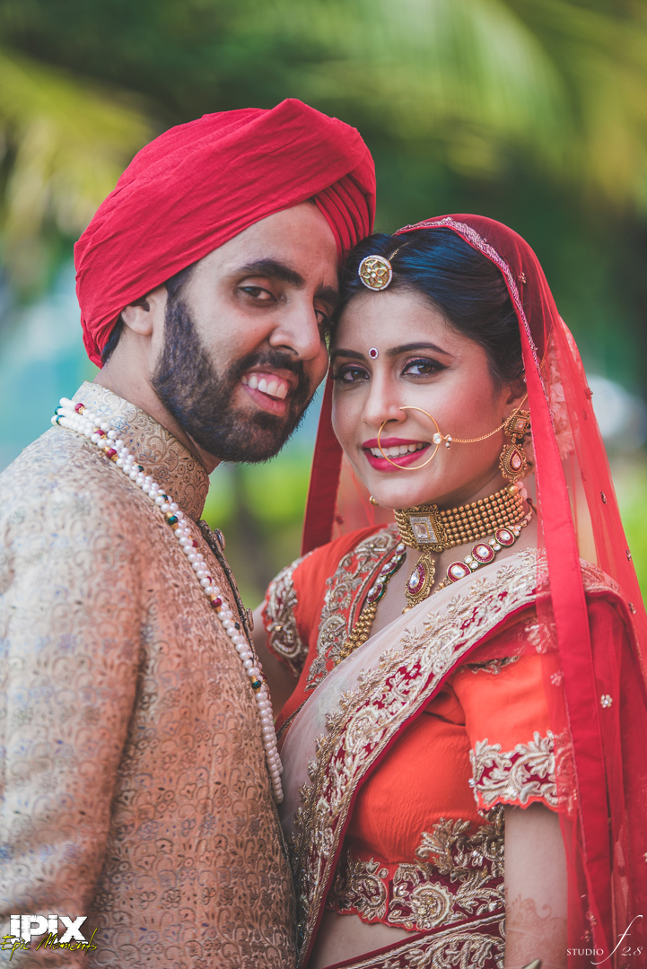 bride and groom red lehenga beautiful Sikh wedding in Grand Hyatt Goa
