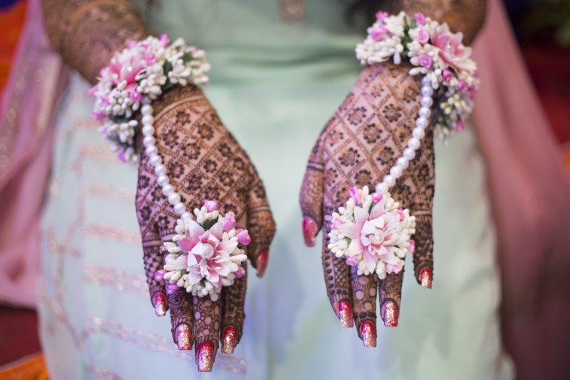 mehendi hands and floral jewelry