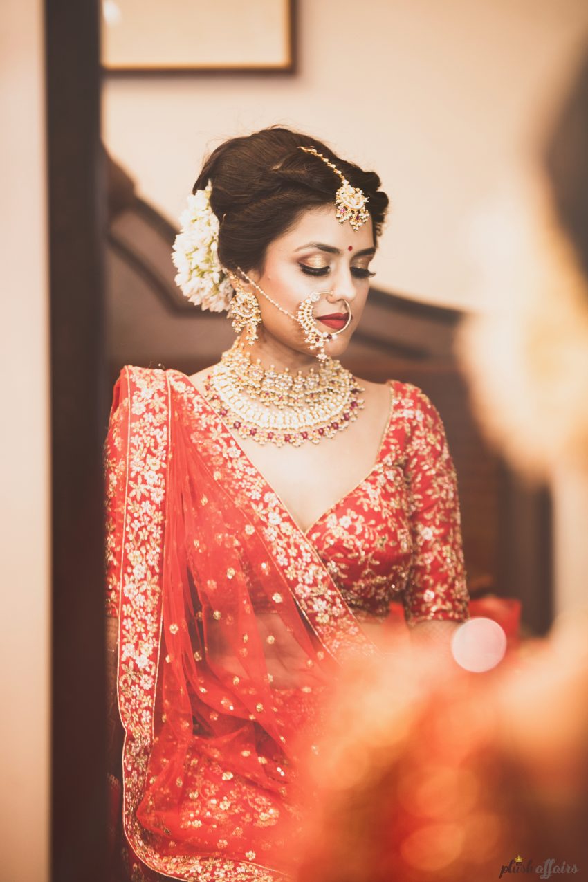real wedding in Bhopal by Plush Affairs photography-bride had embroidered wedding date and names on her wedding lehenga