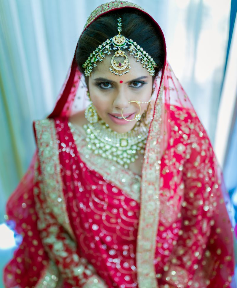 beautiful real wedding of twin sisters pink lehengas matching jewelry